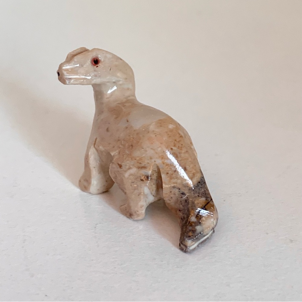 Stone dinosaur figurine